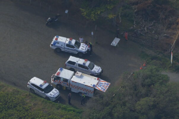 Police and State Emergency Services vehicles at the scene.