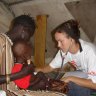 Kent nursing a child in 2007 at the Therapeutic Feeding Centre in Leer, a town in what is now known as South Sudan.