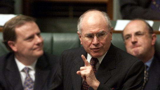 John Howard, with his public service minister Peter Reith (right) and Treasurer Peter Costello (left).