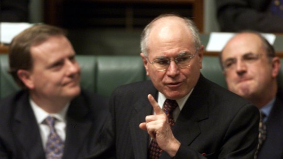 John Howard, with his public service minister Peter Reith (right) and Treasurer Peter Costello (left).