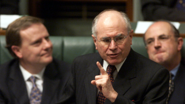 John Howard, with his public service minister Peter Reith (right) and Treasurer Peter Costello (left).