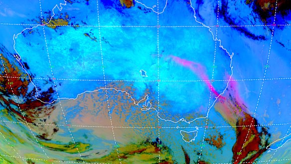 This satellite image from 11.20am on Wednesday shows the dust cloud (in pink) stretching from south-west Queensland, through NSW and into the Tasman Sea. 