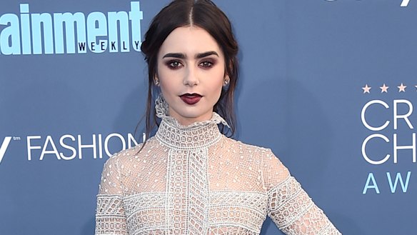 Lily Collins rocks a rich burgundy lip. 