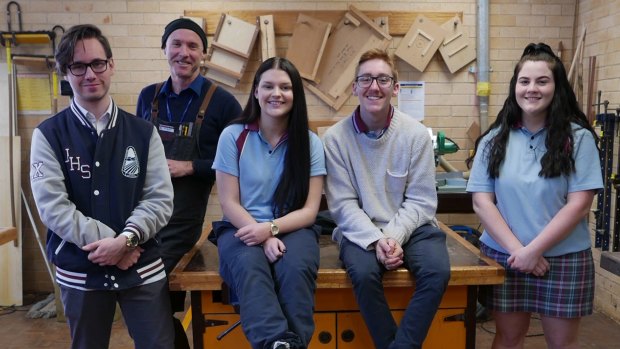Dean Maddock (second left) with students at his timber workshop at Jamison High School. 