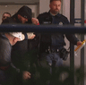 Moahmmed Skaf escorted from Bankstown Hospital by police. The notorious gang rapist has been accused of directing a group engaged in alleged drug supply.