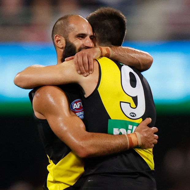 Bachar Houli and Trent Cotchin, his friend and captain, celebrate the 2020 grand final victory.