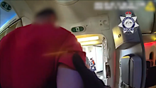 The passenger was forced to be restrained after the alleged assaults.