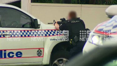 Police have shot dead an armed man in Ipswich, south-west of Brisbane. 