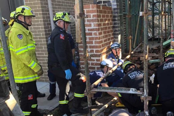 One man was trapped under rubble for around 30 minutes until he was extricated by Fire and Rescue NSW.