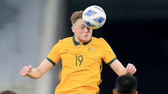 Harry Souttar connects with a header during Australia’s win over Oman.