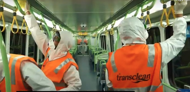 Transclean staff cleaning a Metro train carriage during the COVID-19 pandemic.