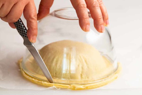 Step 4. Return to freezer to firm pastry, then trim the base using a bowl as a guide.