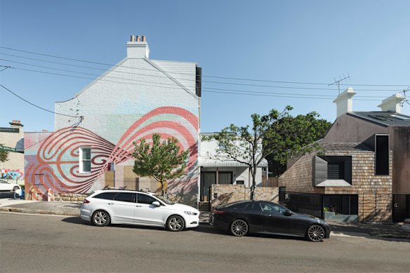 The Passivhaus dwelling (right) that was built on an unutilised piece of land.