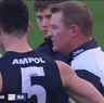 Michael Voss sprays his players.