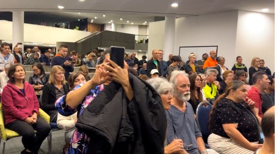 Protesters inside the Monash Council meeting public gallery.