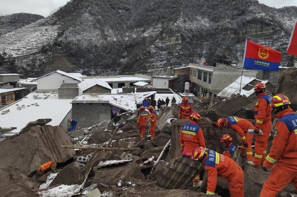 Rescue workers deal with the aftermath of a landslide in Yunnan province, China.