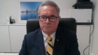 Agent-general Stephen Cartwright gives evidence via video on Wednesday morning.