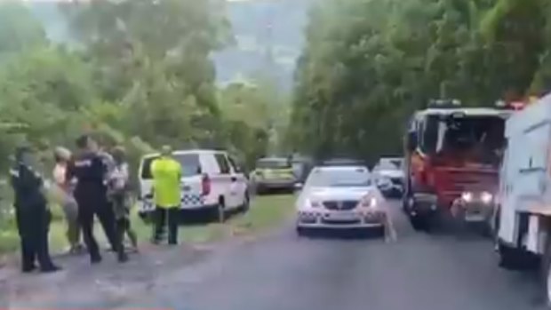 Emergency services at the Tallebudgera Valley property, which was declared a crime scene.