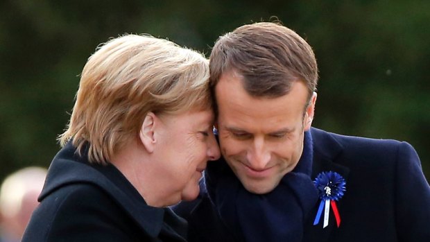 French President Emmanuel Macron, right, and German Chancellor Angela Merkel during a ceremony in Compiegne, north of Paris.