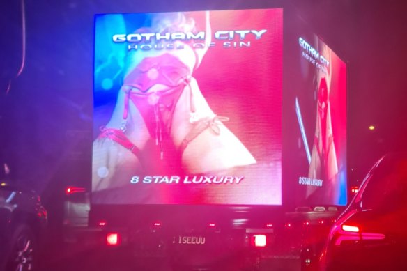 An image on a mobile billboard for Gotham City brothel, seen in 2023.