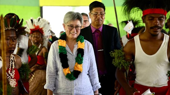 Penny Wong, pictured in Papua New Guinea, has visited 12 Pacific nations since the election.