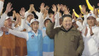 North Korea leader Kim Jong-un celebrates with scientists a claimed launch of a spy satellite. 