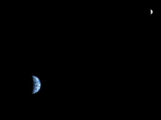 The view of Earth from Mars. This was taken by NASA's Mars Reconnaissance Orbiter, in orbit around the red planet. The moon is top right.