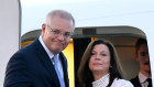 The Prime Minister and wife Jenny boarding the RAAF VIP jet at Sydney Airport on June 27. 