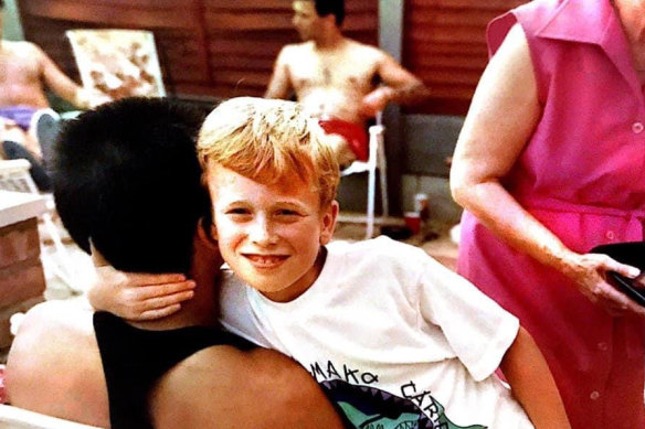 Gary Nunn, aged about eight, with his father. In his younger days, the author did enjoy hugs from his dad.