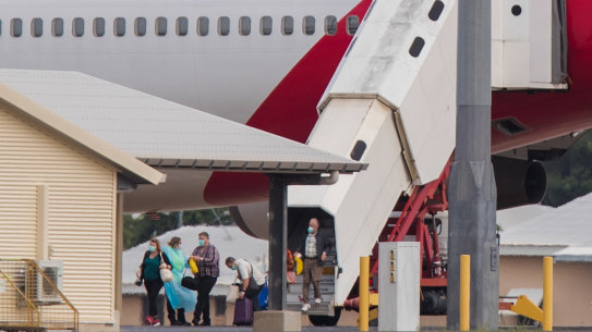 Australian evacuees from Diamond Princess arrive in Darwin on Thursday.