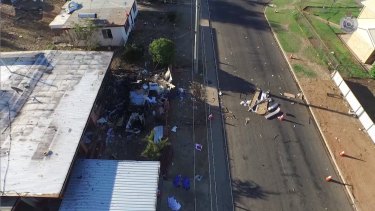 The remains of a caravan that exploded in the Mount Isa suburb of Mornington, killing Charlie Hinder, 39, and his children, Nyobi, 7, and River, 4.