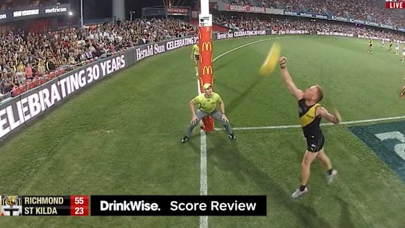 Vlastuin stretches to touch the ball. 