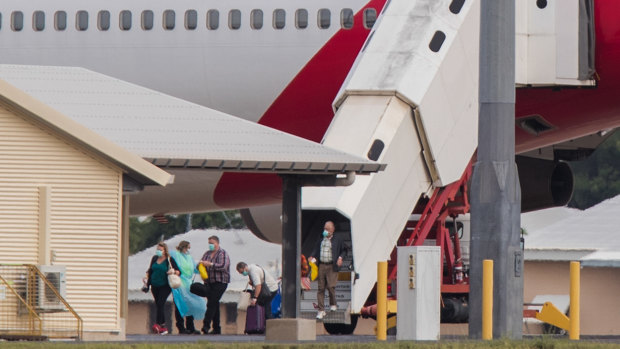 Australian evacuees from Diamond Princess arrive in Darwin on Thursday.