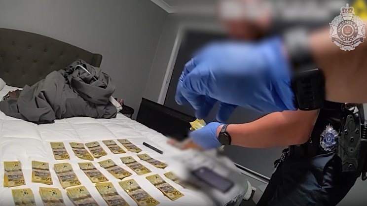 brisbanetimes.com.au - Julius Dennis - Cash, drugs seized as police charge 38 people linked to alleged syndicate
