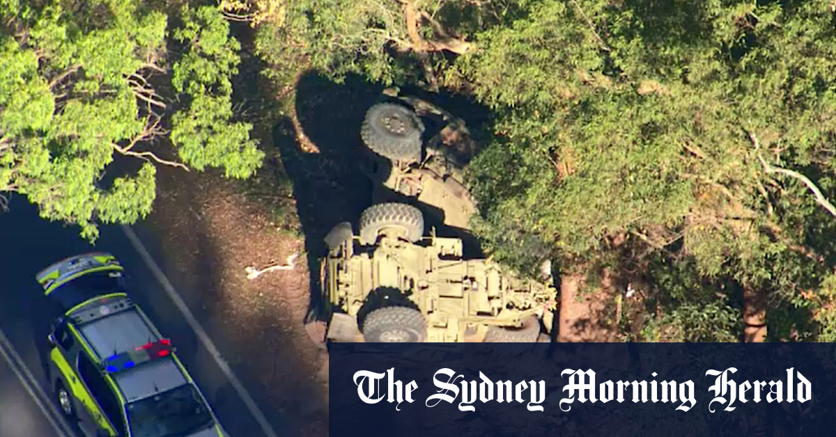 Injured woman stuck in vehicle after Brisbane army truck roll-over