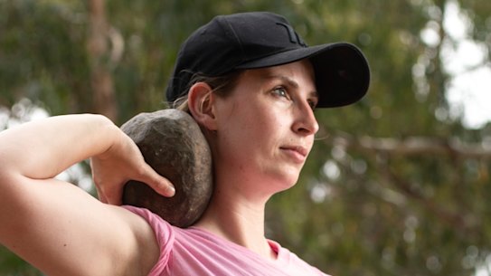 Helen Oakley With one of the rocks in the rock throwing competition. 