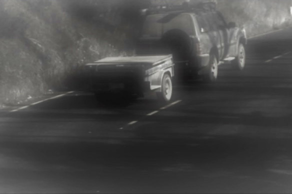 Lynn’s vehicle and trailer travel past a camera on the Great Alpine Road.