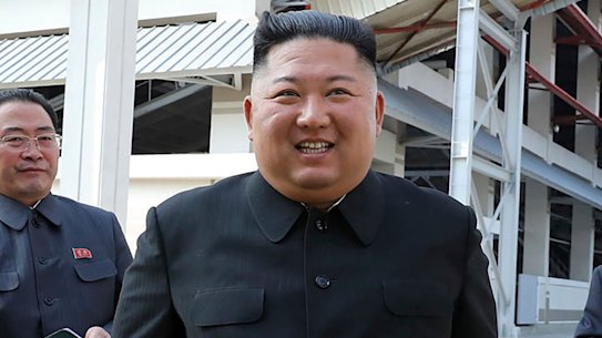 North Korean leader Kim Jong-un, centre, visits a fertiliser factory in South Pyongan, near Pyongyang, North Korea.