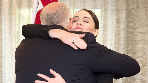 Scott Morrison and  Jacinda Ardern hug following Friday's service for those killed in Christchurch.