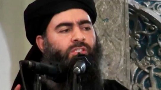 An image made from video posted on a militant website in 2014 purports to show Abu Bakr al-Baghdadi delivering a sermon at a mosque in Iraq.