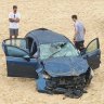 Woman dies after car crash through railing on Maroubra beach