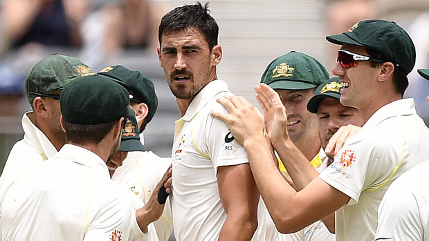 Fired up: Mitchell Starc looks back to Indian batsman Murali Vijay after he was dismissed for a duck on day two of the second Test match.