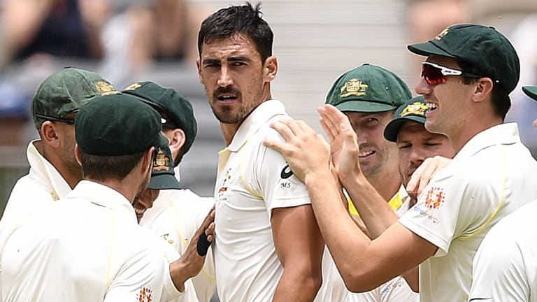 Fired up: Mitchell Starc looks back to Indian batsman Murali Vijay after he was dismissed for a duck on day two of the second Test match.