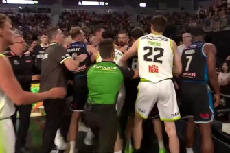 United and Phoenix players clash after Mitch Creek’s dunk.