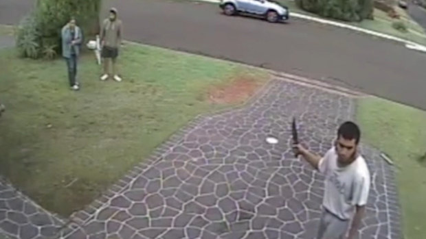 Screengrabs from CCTV of Ihsas Khan using a large hunting knife to inflict life-threatening injuries to Wayne Greenhalgh in the attack at a Minto reserve in 2016.