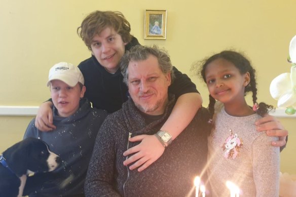 Robert Pether, who has been detained in Iraq since April, pictured with his three children. 