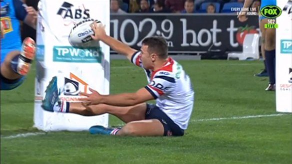 Controversy: Sean O'Sullivan rolls the ball down the post padding, with the Bunker giving the try the green light.