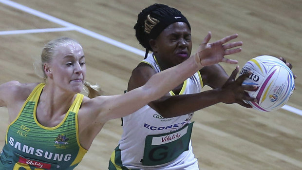 Putting up a fight: Australia's Jo Weston and Zimbabwe's Ursula Ndlovu battle for the ball at the M&S Bank Arena in Liverpool, England.