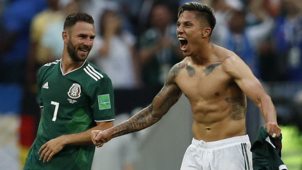 Mexico's Carlos Salcedo (middle) and Miguel Layun celebrate the upset win.