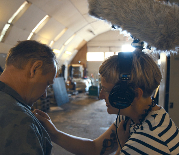 Filmmaker Emma Sullivan adjusts the lapel microphone on Peter Madsen for an interview recorded just hours before he murdered journalist Kim Wall aboard his submarine.